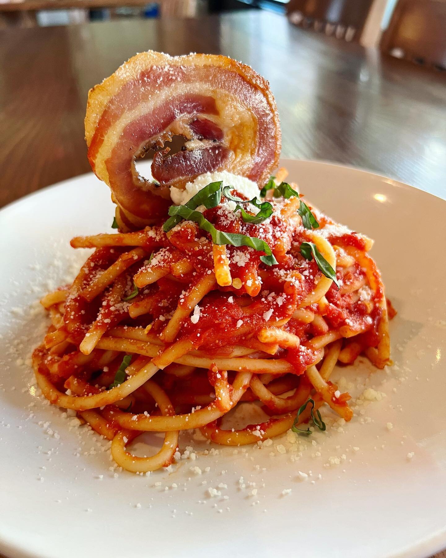 Tonight&rsquo;s feature: bucatini all'amatriciana 

This dish features house made spicy red sauce, pancetta, finished with whipped pecorino romano ricotta, and a crispy pancetta wheel