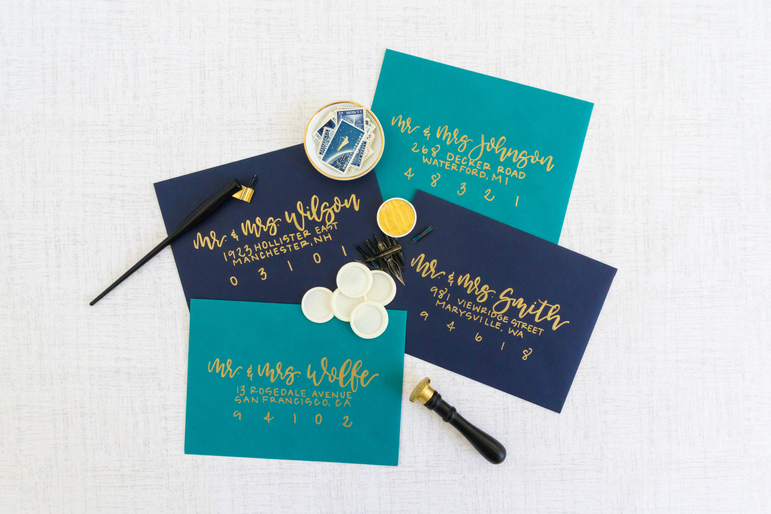 love-fern-design-studio-custom-wedding-invitations-for-the-modern-couple-modern-calligraphy-in-seattle-washington-custom-wedding-stationery-navy-gold-teal-envelopes