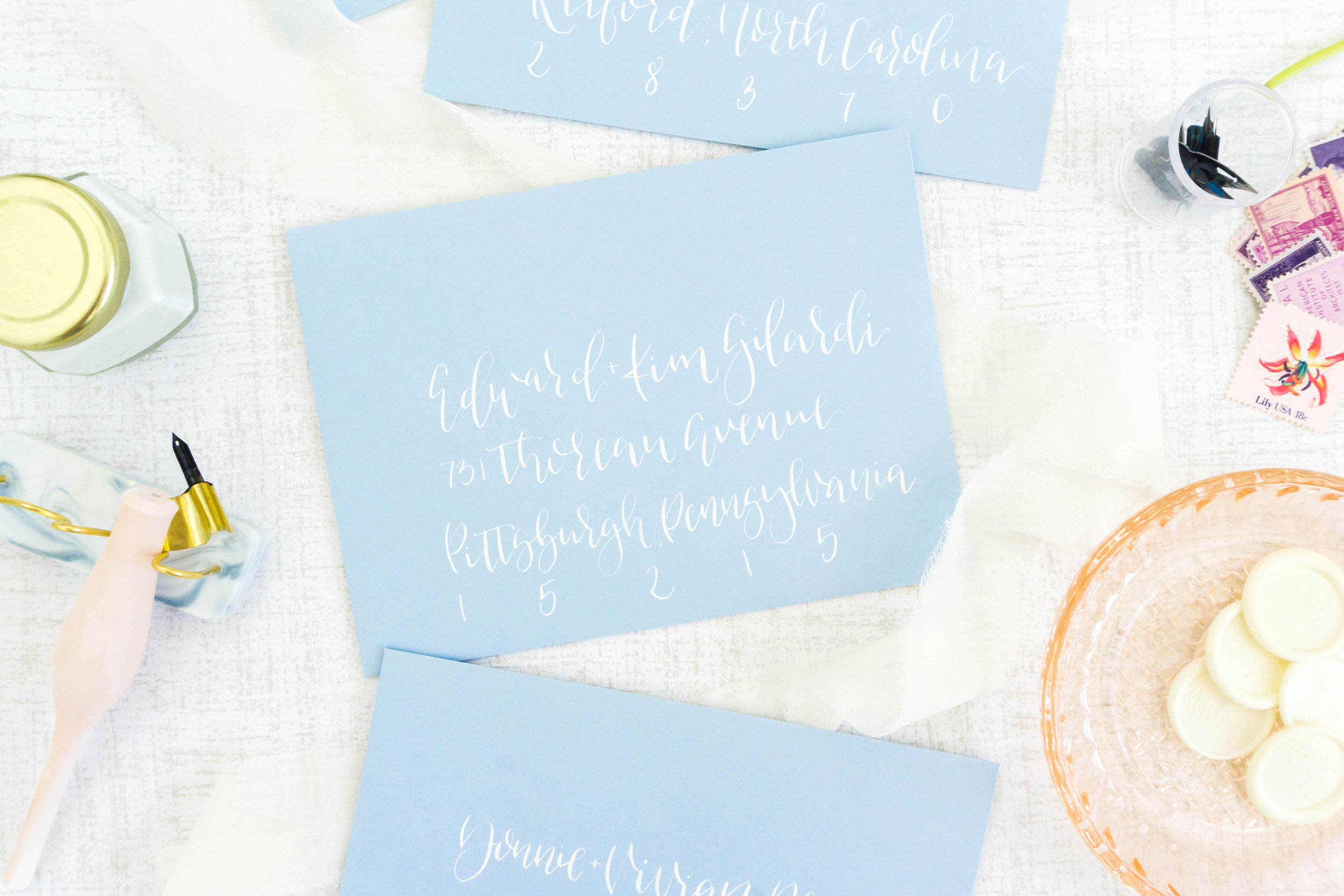 love-fern-design-studio-custom-wedding-invitations-for-the-modern-couple-modern-calligraphy-in-seattle-washington-custom-wedding-stationery-french-blue-calligraphy-envelopes-white-ink
