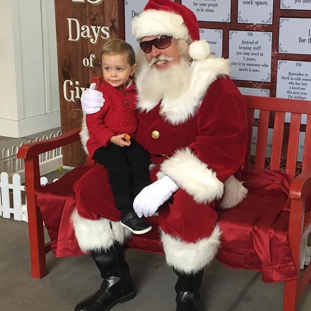 Surf City Santa was a bit of a bust since he wasn't in his airstream due to rain.... lol. But Johnny told him he wants Chick Hick's Mack and Jeff Gorvette's pit crew.... this kid lives and breathes Cars β€π