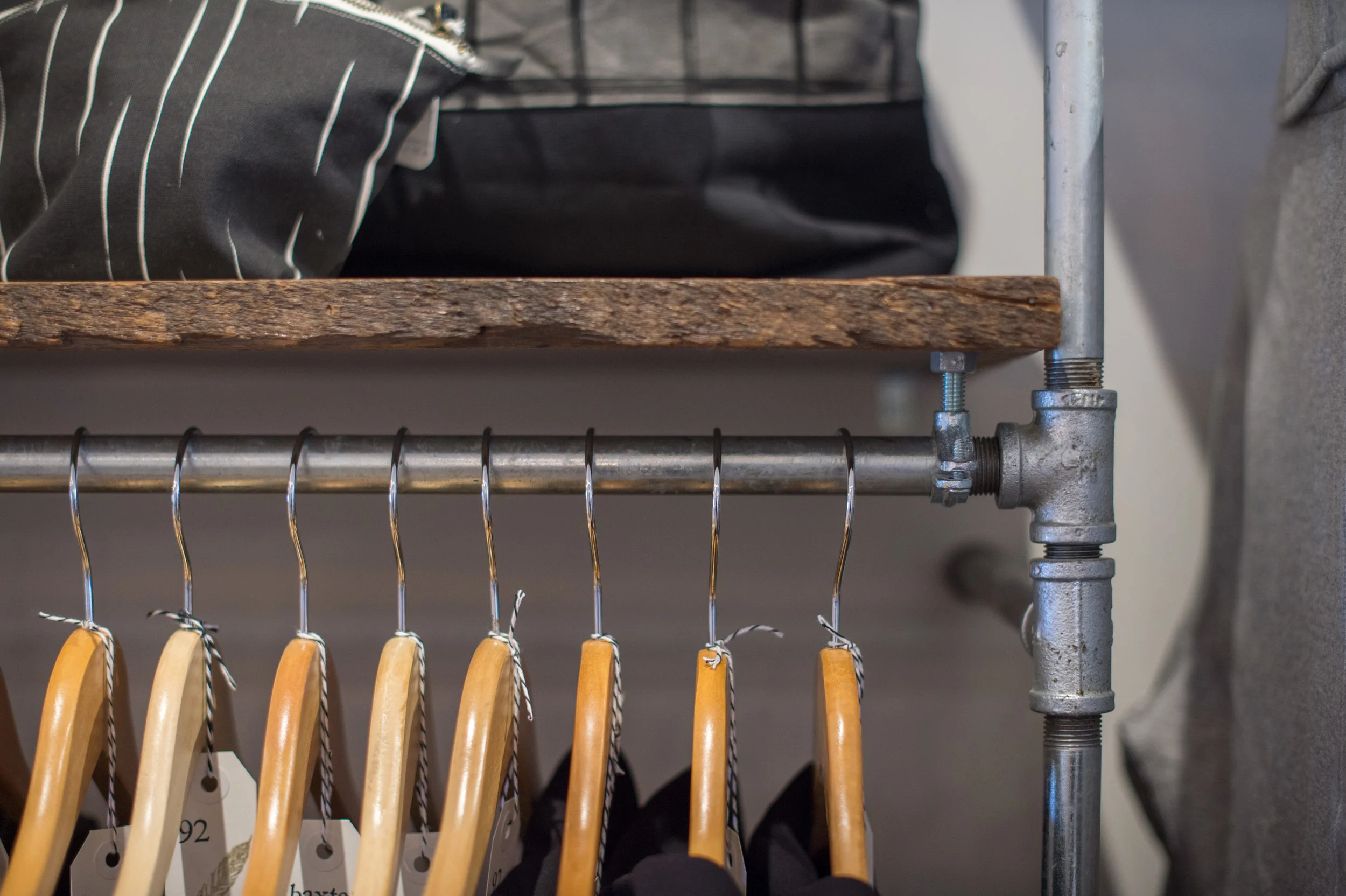 Clothing rack details. 1/2" galvanized piping never looked so good.