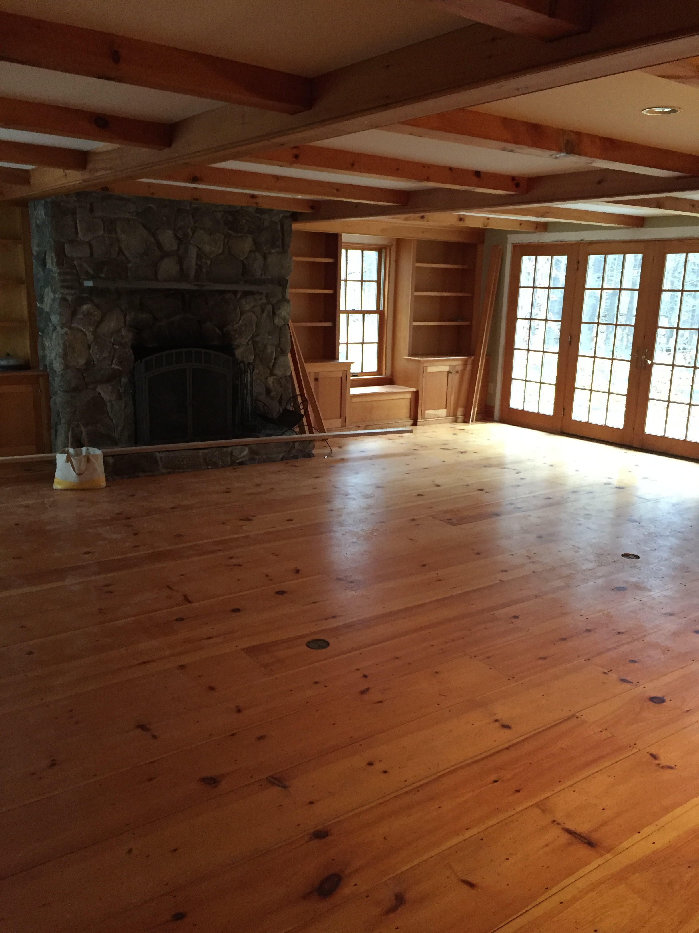 Sometimes we'll get an inquiry from a client who needs our help with just the furniture and finishes in their home. This living room was a blank slate, and we all agreed that it needed some brightening up, in addition to some upholstery that would ground the room and balance the stone fireplace.