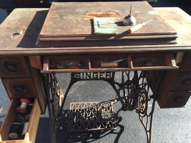 This Singer sewing machine dates back to the early 1900's and belonged to our client's grandmother. Because of it's sentiment we thought it would be so cool to incorporate it into her boutique space that was under renovation. It had all the right bones, but would need a little sprucing up!