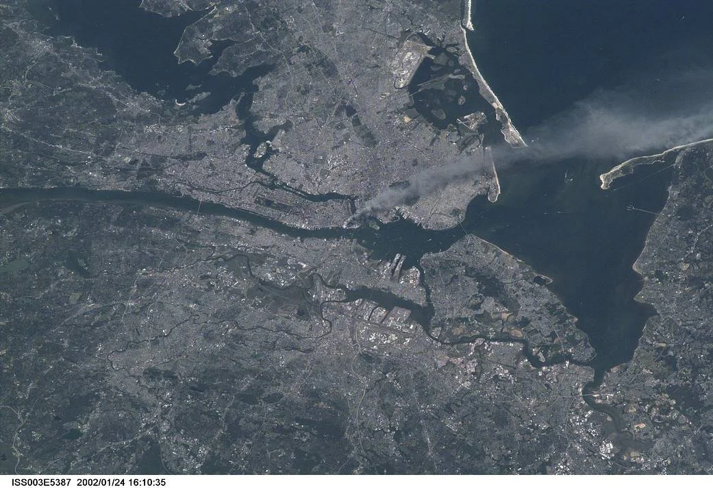 Photograph Credit: Frank Culbertson, Astronaut and Station Commander, United States Aeronautics and Space Administration - On Board the International Space Station, 2001/09/11 - World Trade Center from the International Space Station.