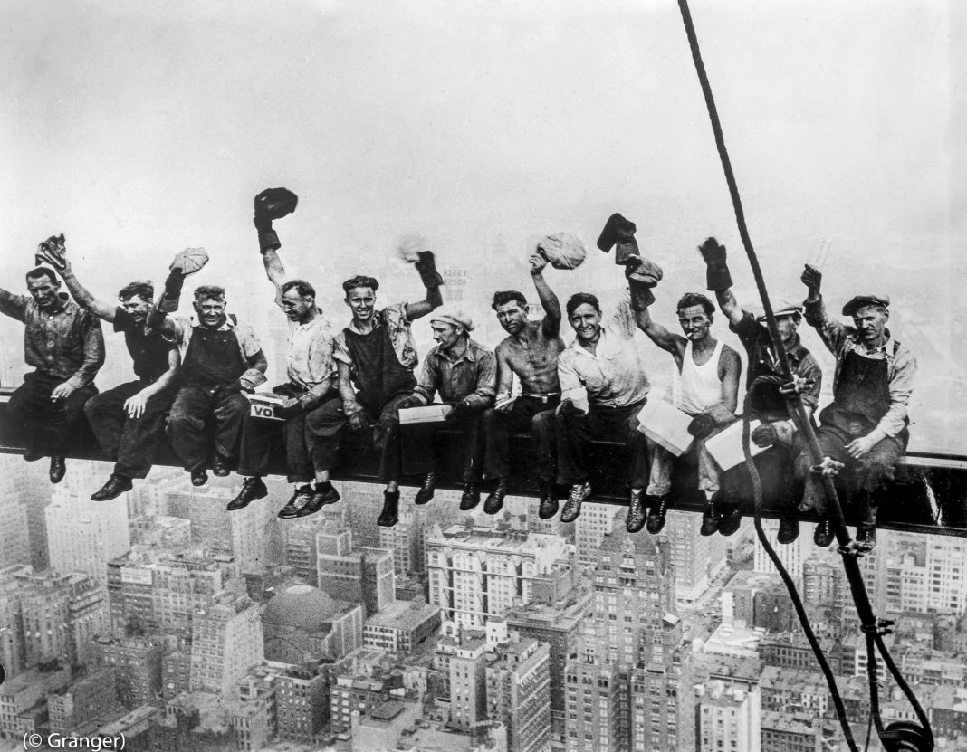 Construction workers sit on a New York City skyscraper girder in 1932. The building today is known as Rockefeller Plaza. (Image Credit © Granger)