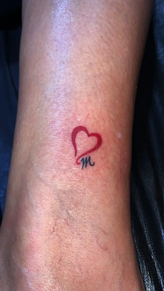 small-red-heart-with-the-letter-M-on-the-hand.jpg
