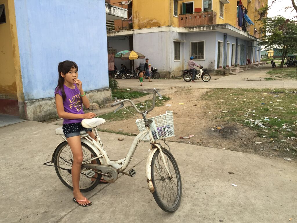 A young girl from the Phu Hiep community posing with her bike