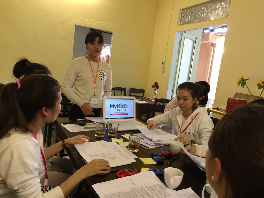 Trinh presenting the How to Brush Your Teeth lessons to the group