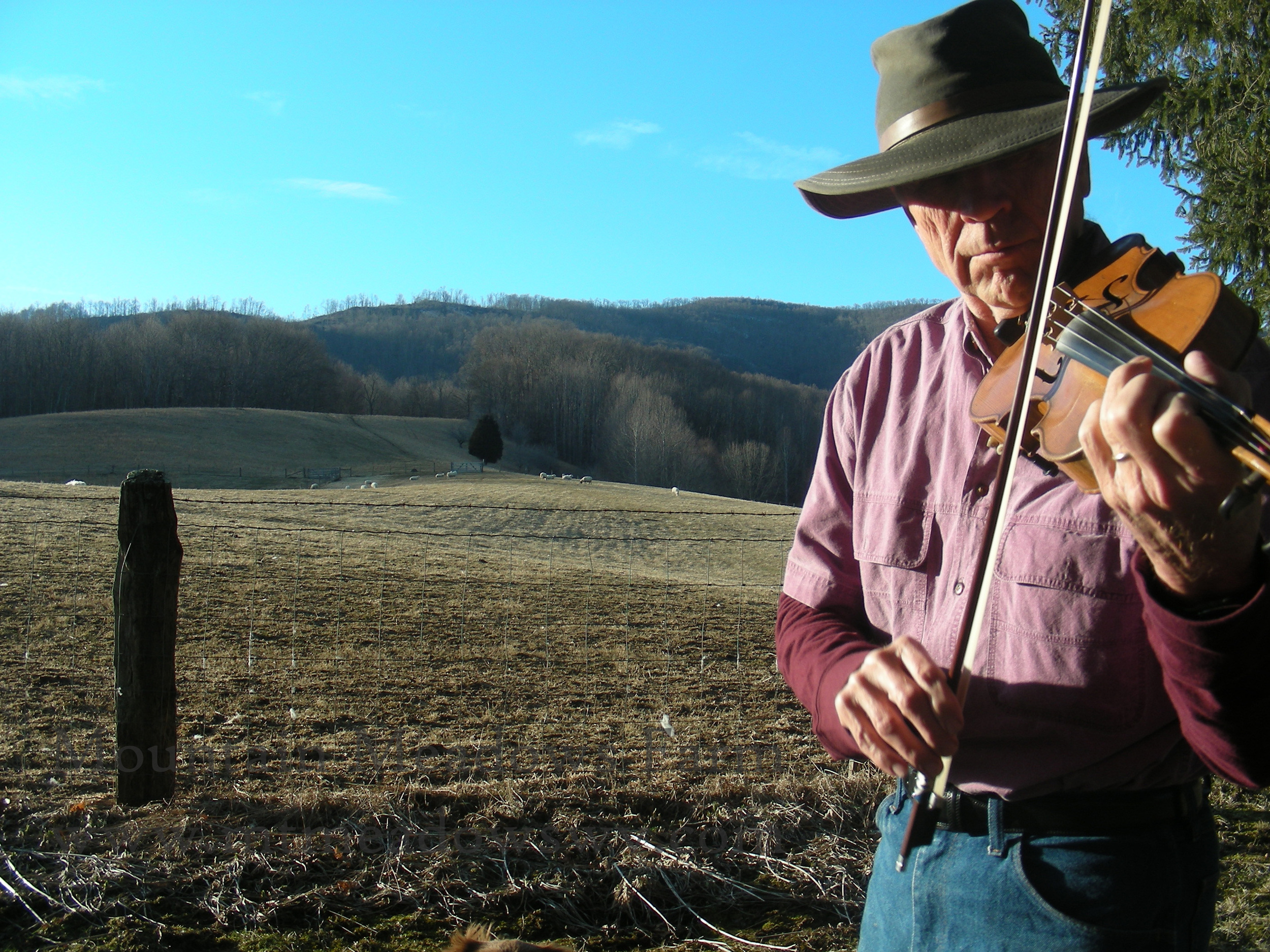 John trying out Annie's fiddle - sure is different!