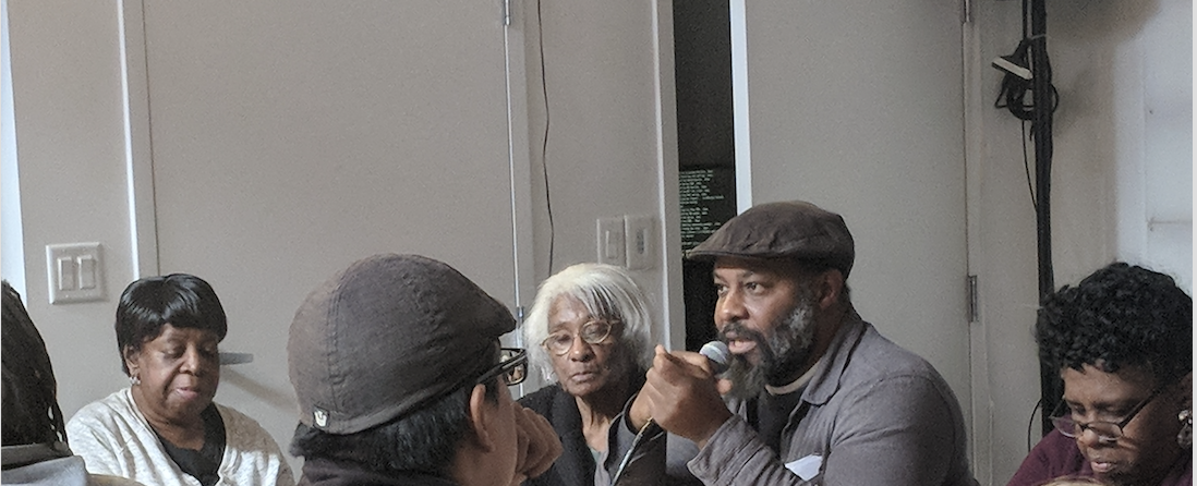 All ears on Kali Akuno as he discusses the cooperative business model to public housing residents and allies.