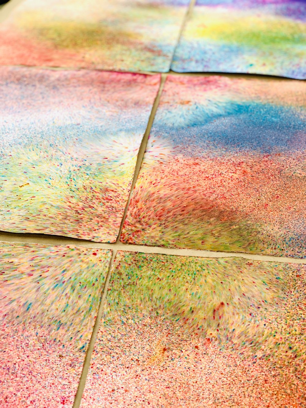  Three photographs of Marisa Morán Jahn’s vibrant hand-dyed rainbow wallpaper tiles.  