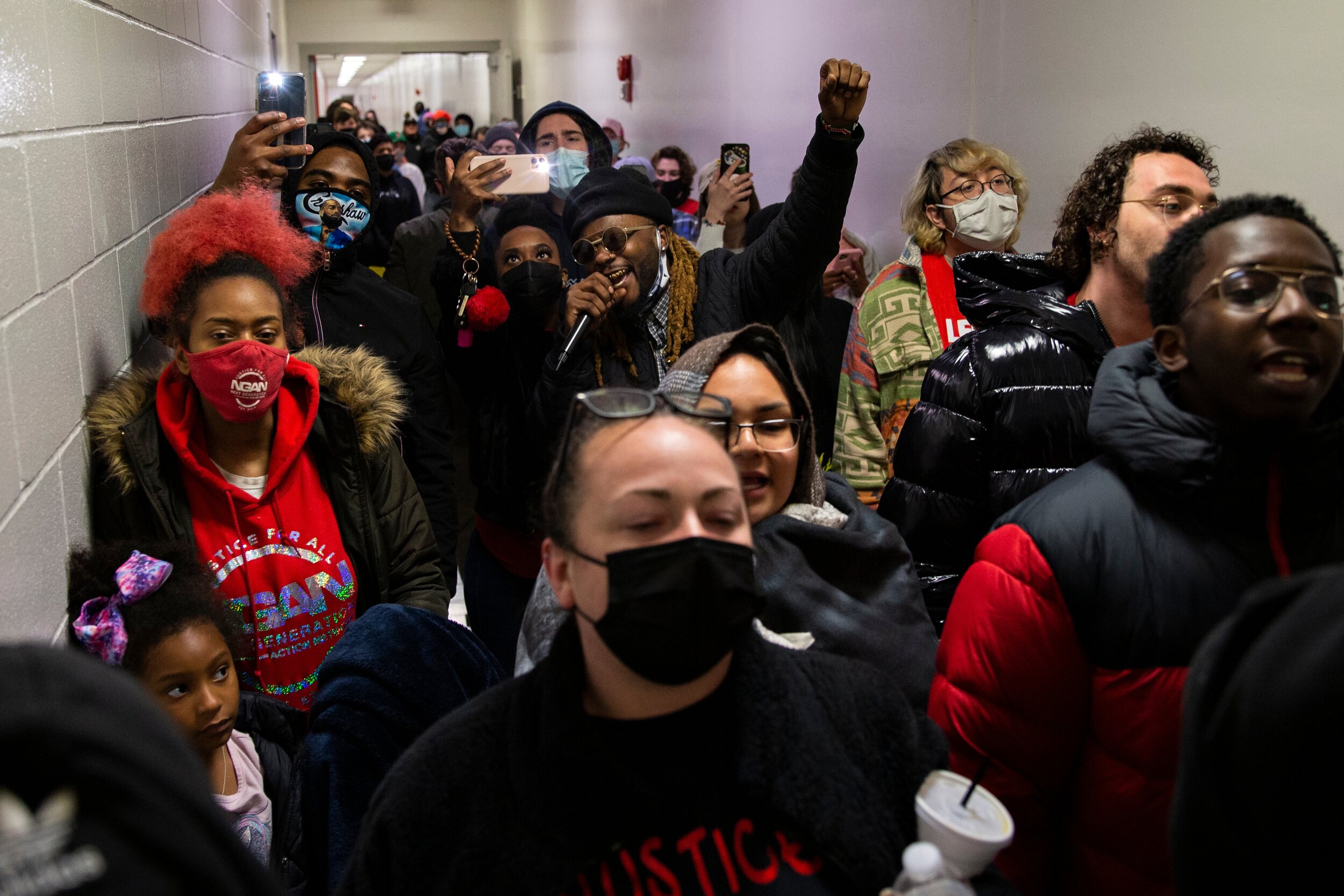  Christopher A. Williams-Watkins (center) leads a chant demanding for justice in the halls of the Collin County Jail for his friend Marvin Scott III, who died while in custody in the jail in McKinney, TX.  