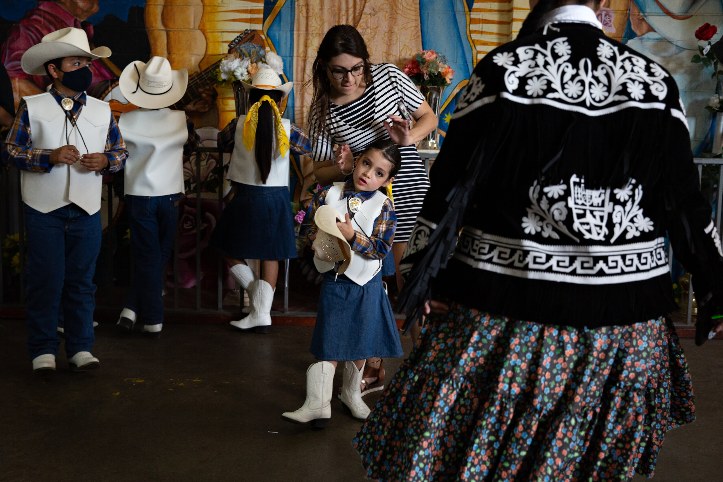  Tania Avila helps her daughter Aleana get ready for her performance at Casa Guanajuato’s Día de las Madres festival in Dallas, TX on May 8, 2021.  