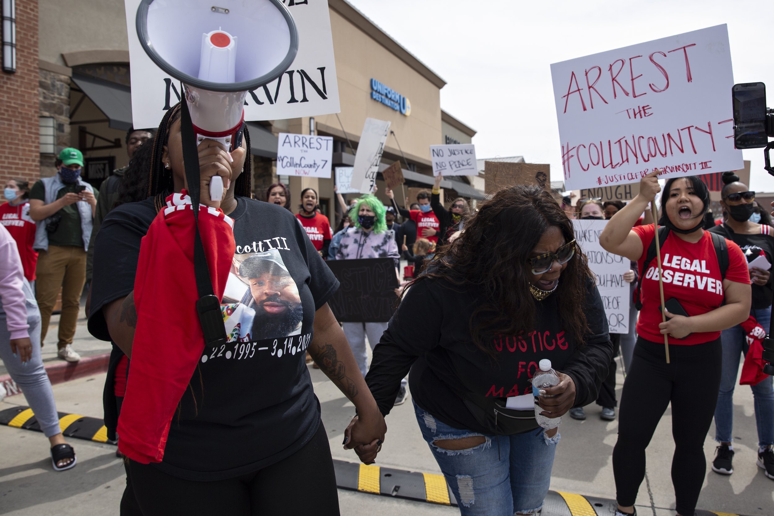  LaChay Batts and her mother LaSandra Scott chant for justice for Marvin at their first march on March 21, 2021 at the Allen Outlets , where he was arrested for possession of less than 2 ounces of cannabis. 