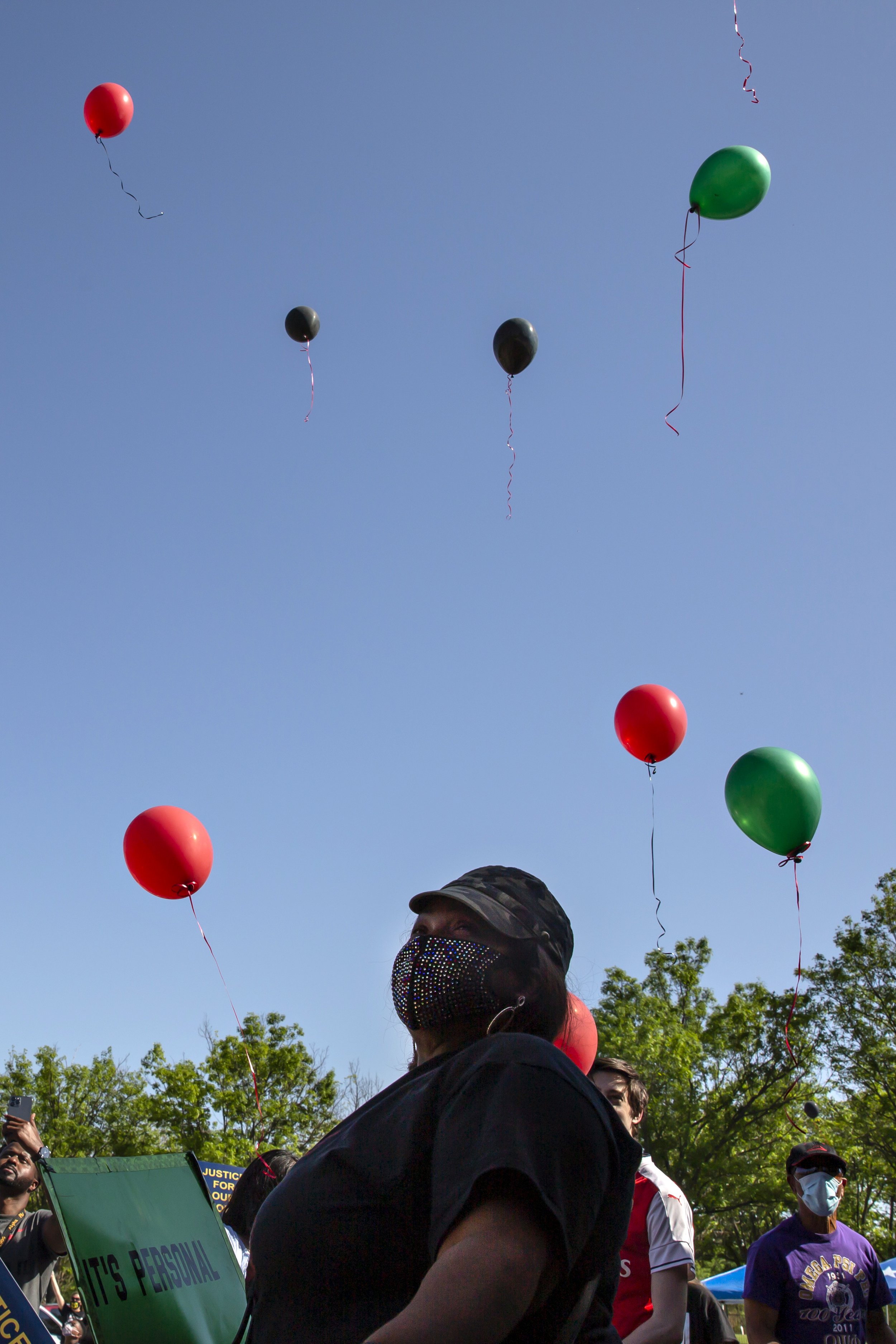  LaSandra Scott releases her balloon at a demonstration in Allen held by the Collin County NAACP advocating justice for Marvin Scott III on April 11, 2020. 