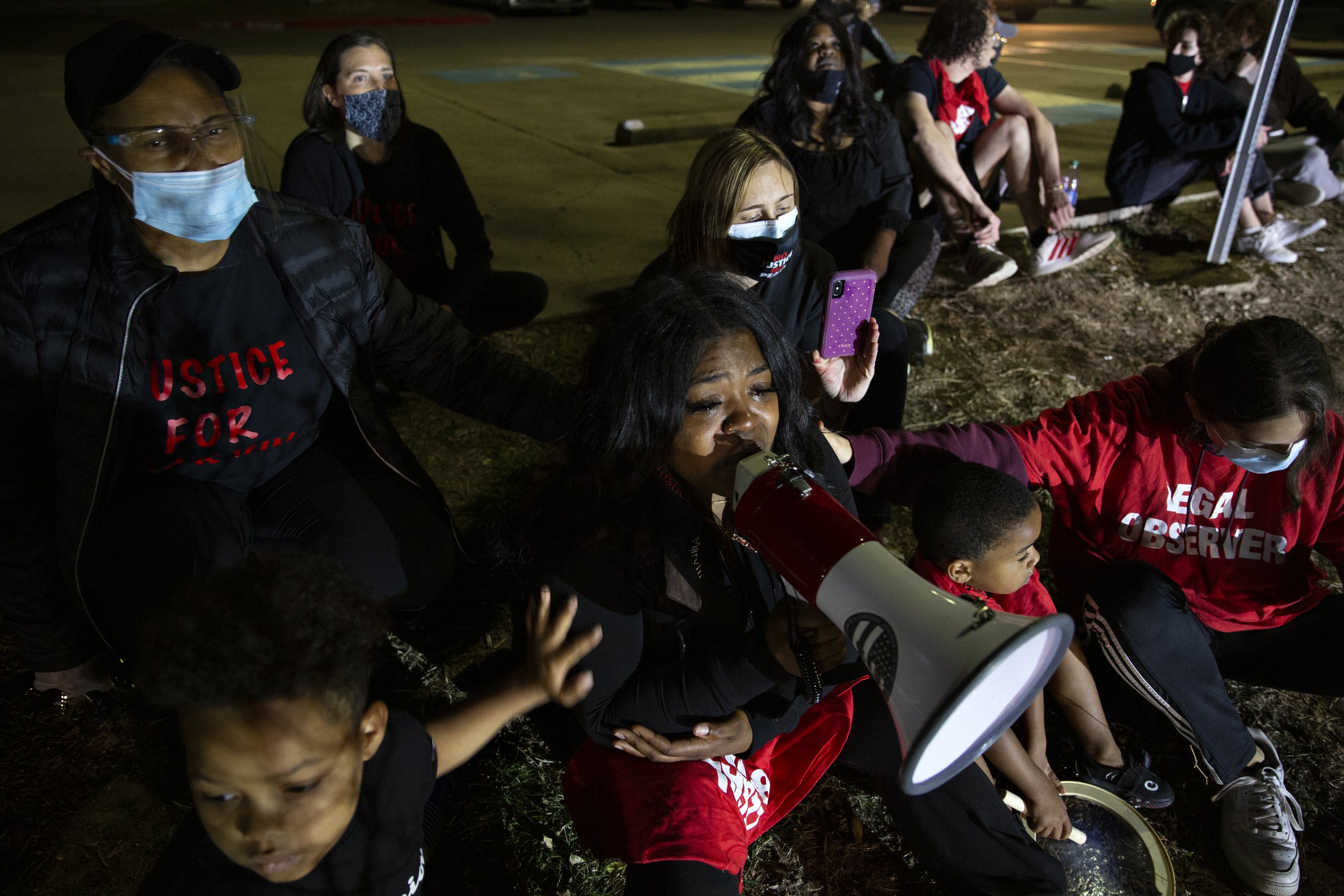  LaChay Batts, Marvin Scott III’s older sister, is surrounded by her sons and fellow demonstrators as she tearfully addresses several police vehicles that moved the demonstration out of their assigned “Designated 1st Amendment Protest Area” at the Co