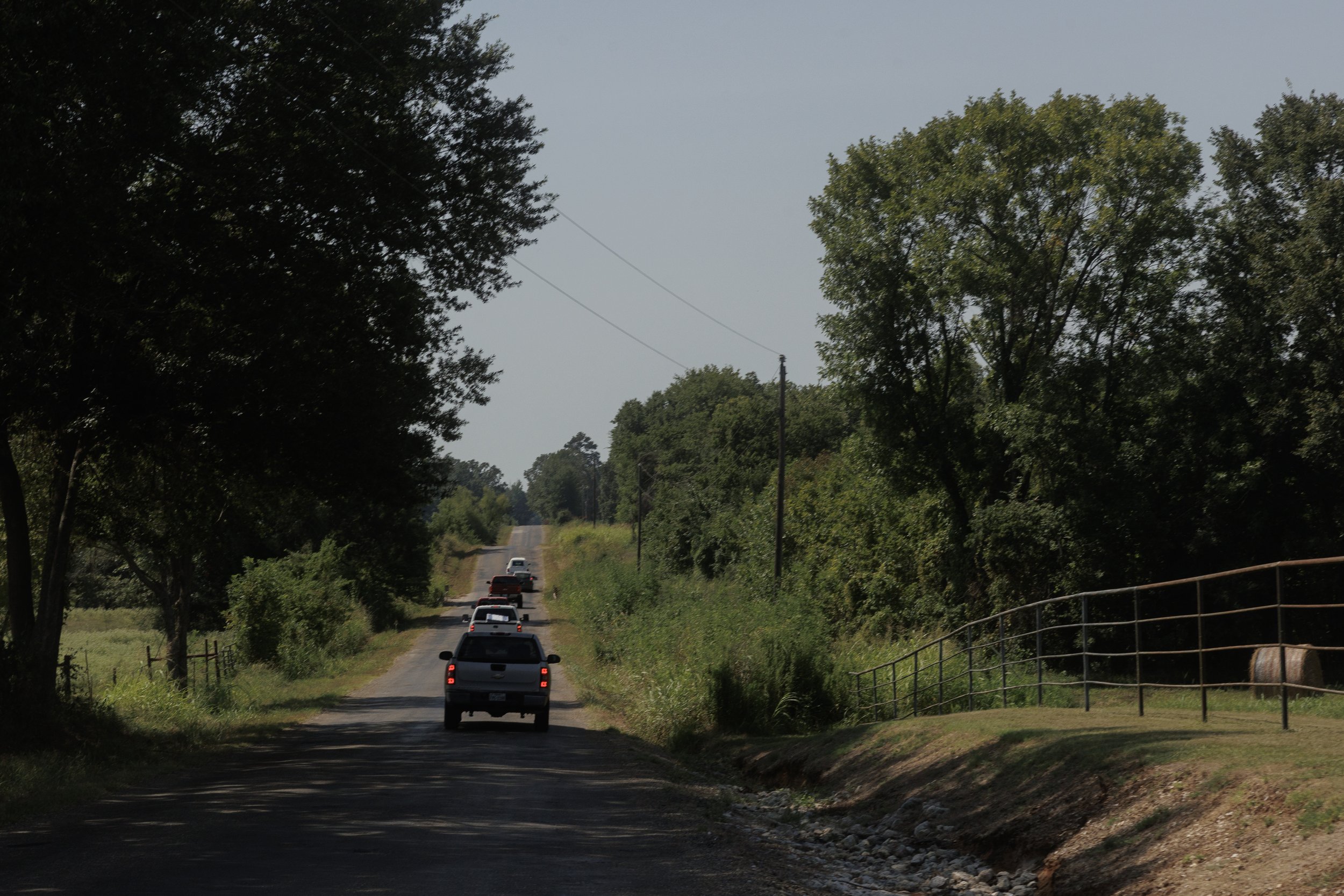  The funeral procession drives down country roads to the cemetery where the twins will be buried in Broken Bow, Oklahoma. 