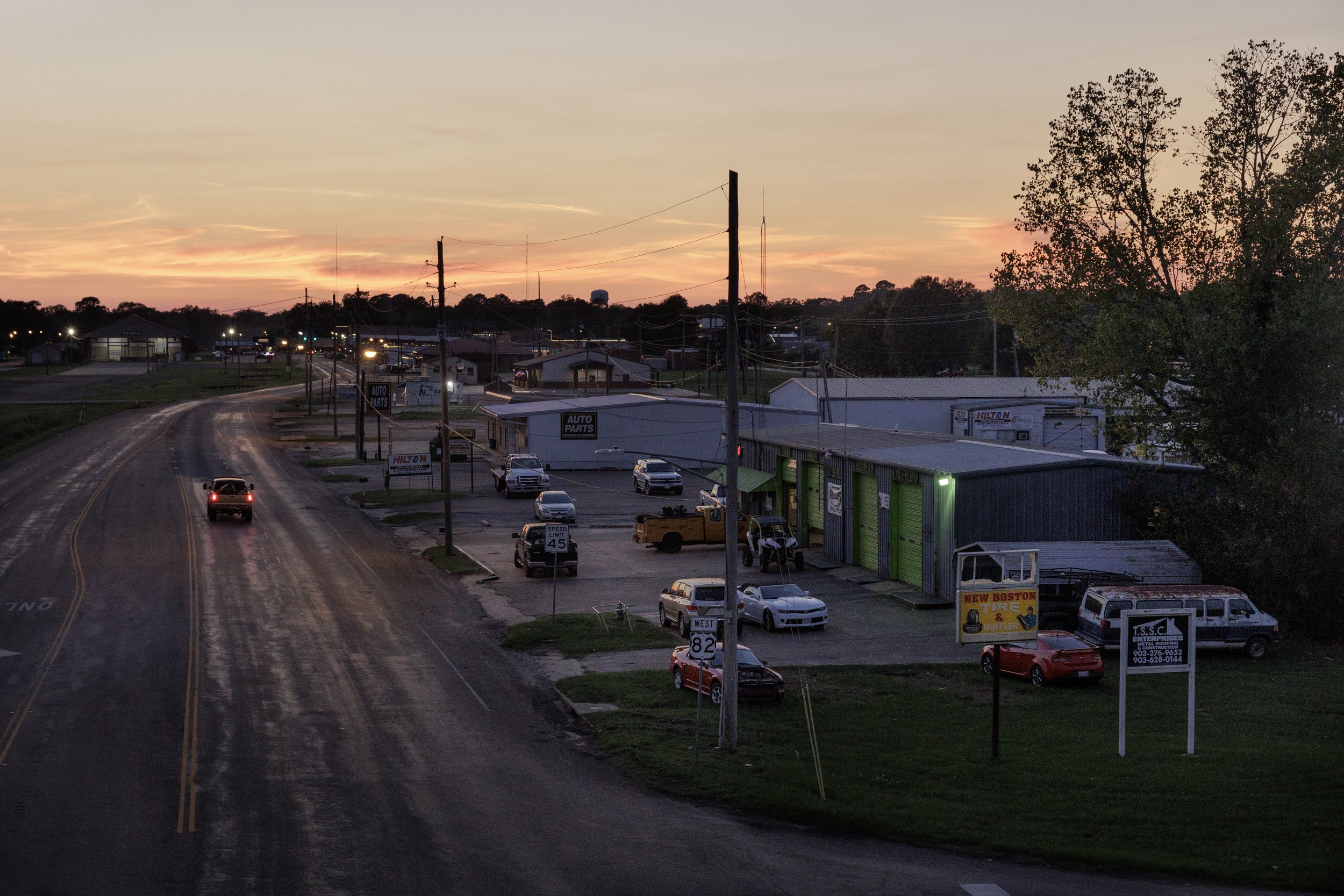  New Boston, TX at sunset. Over the next few months, Miranda would learn how difficult it is to carry a high-risk pregnancy in rural Texas. New Boston was 30 minutes from the nearest hospital, and three hours from the specialists she needed.  