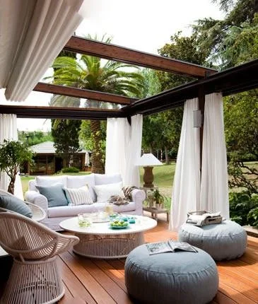 These outdoor curtains add a decorative element to any backyard. In addition to the privacy and shade factor, there is an extra cover positioned at the top of the structure to completely shade the entire unit if need be. This would be an awesome element for your backyard room come rain or shine. Image as seen on Farmington Homebuilder