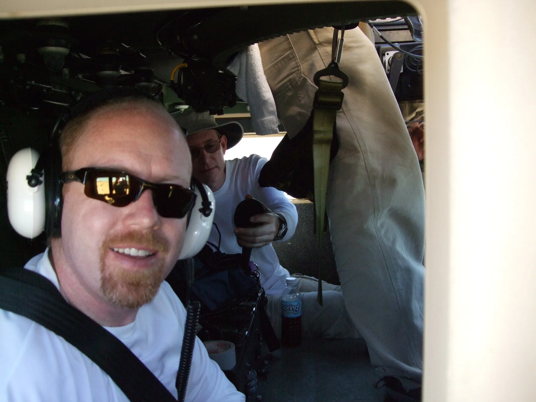 Nathan Smith, Aaron Marks, Watson Wu, and Kevin Collins recording a humvee