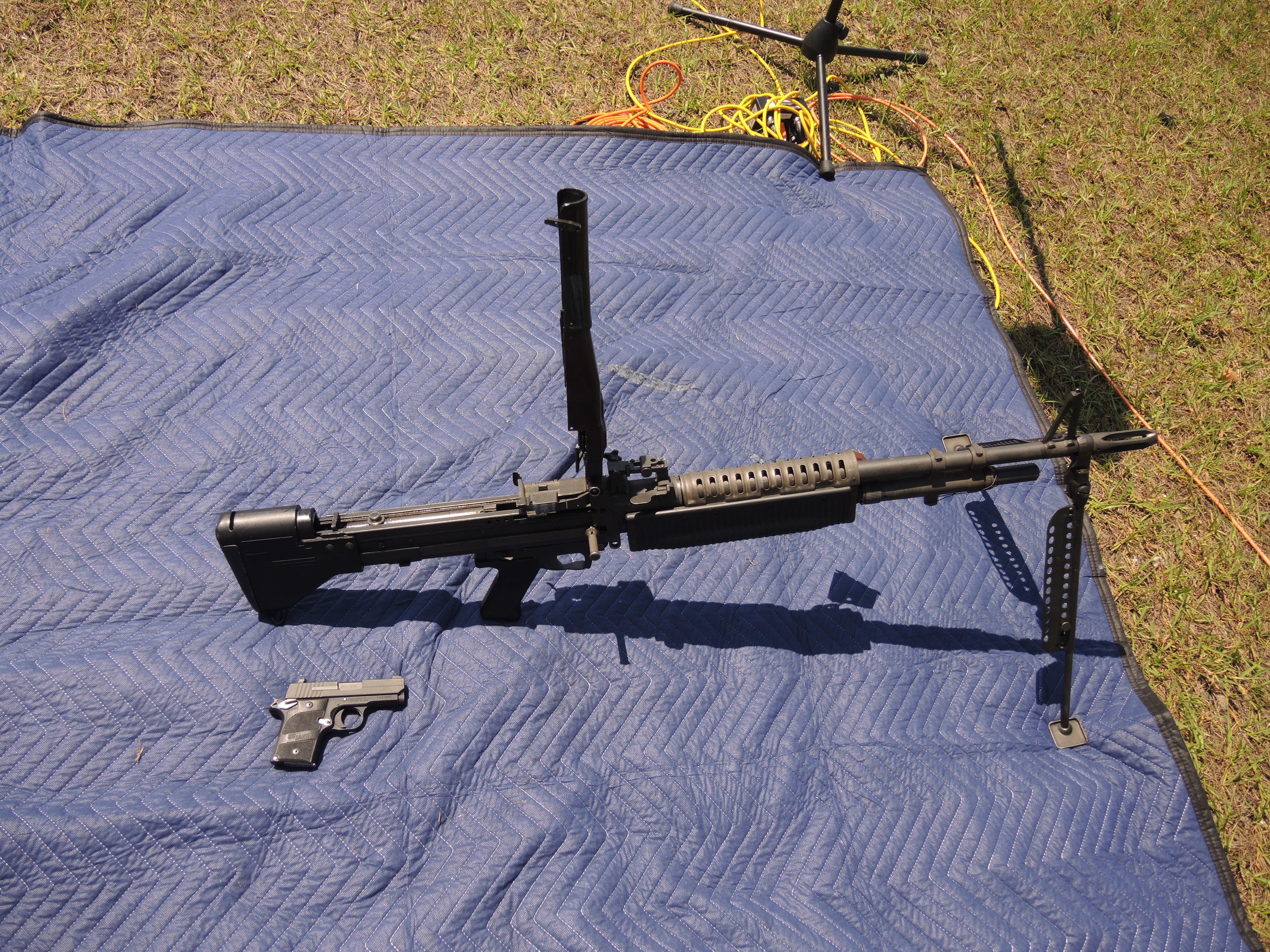 DSCN9968 M60 machine gun vs small 9mm pistol.JPG