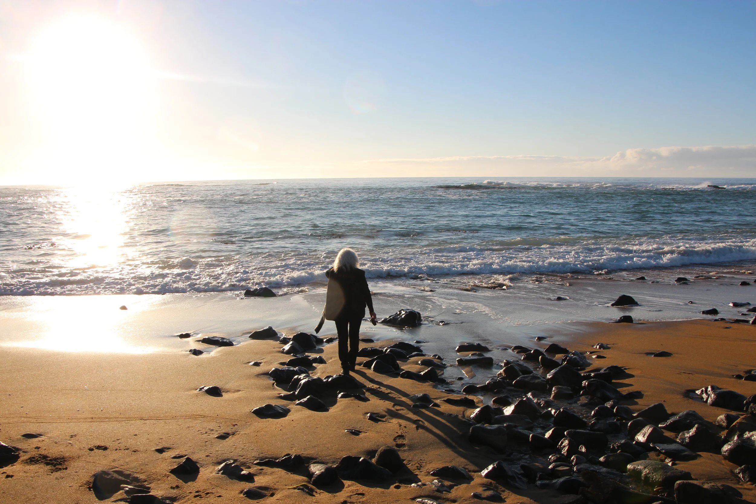 Chef Fleur Sullivan on the shores of Moeraki Bay, New Zealand