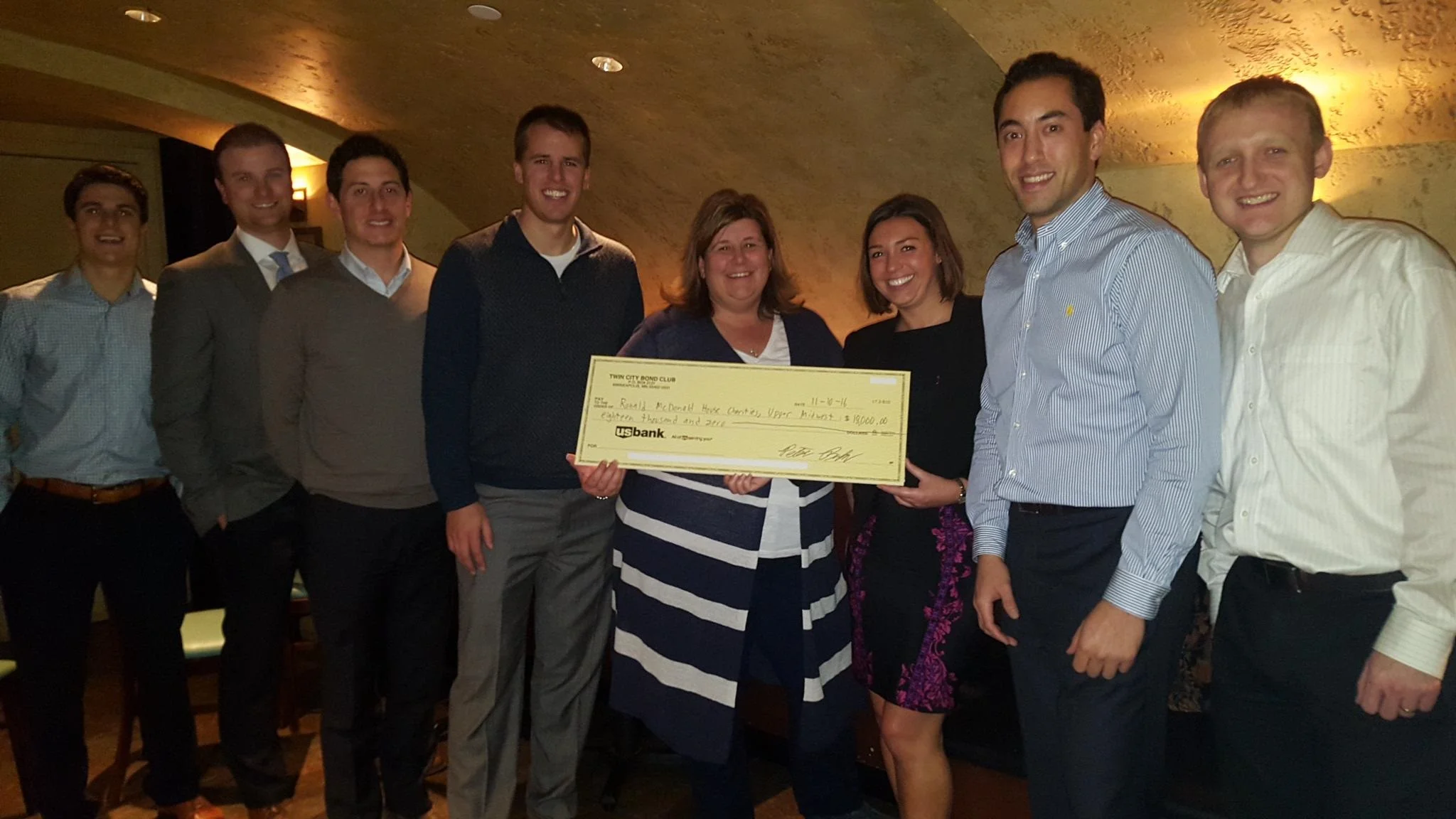 Check for $18,000 given to the Ronald McDonald House Twin Cities