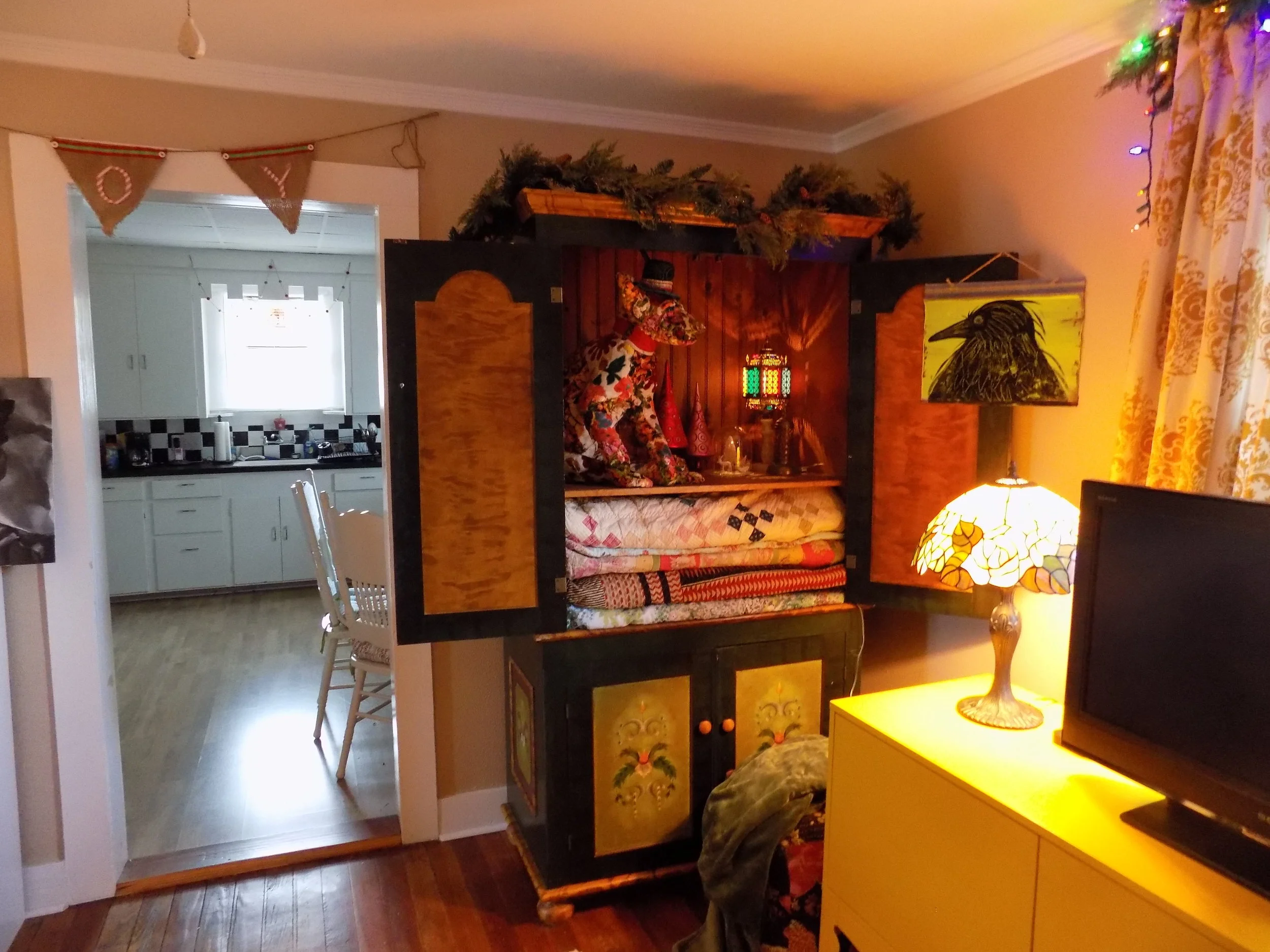 I found this amazing hand-painted cabinet at The Round Top Antique Show. It houses my bed linens... and another incredible textile piece by Meredith Hadaway.