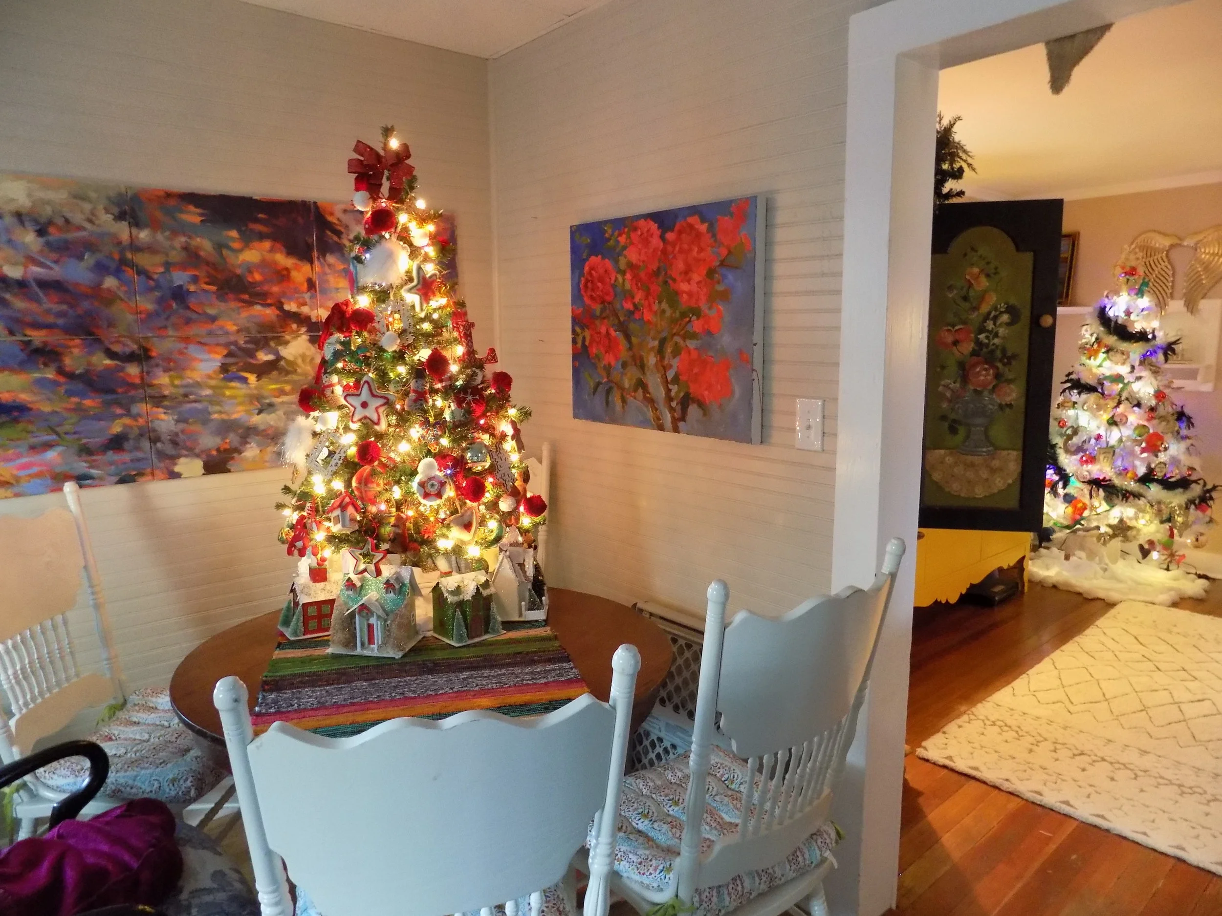 The kitchen tree: this is usually some variation of red and green. My pieced project Water Reflections makes a great backdrop along with a floral commission.