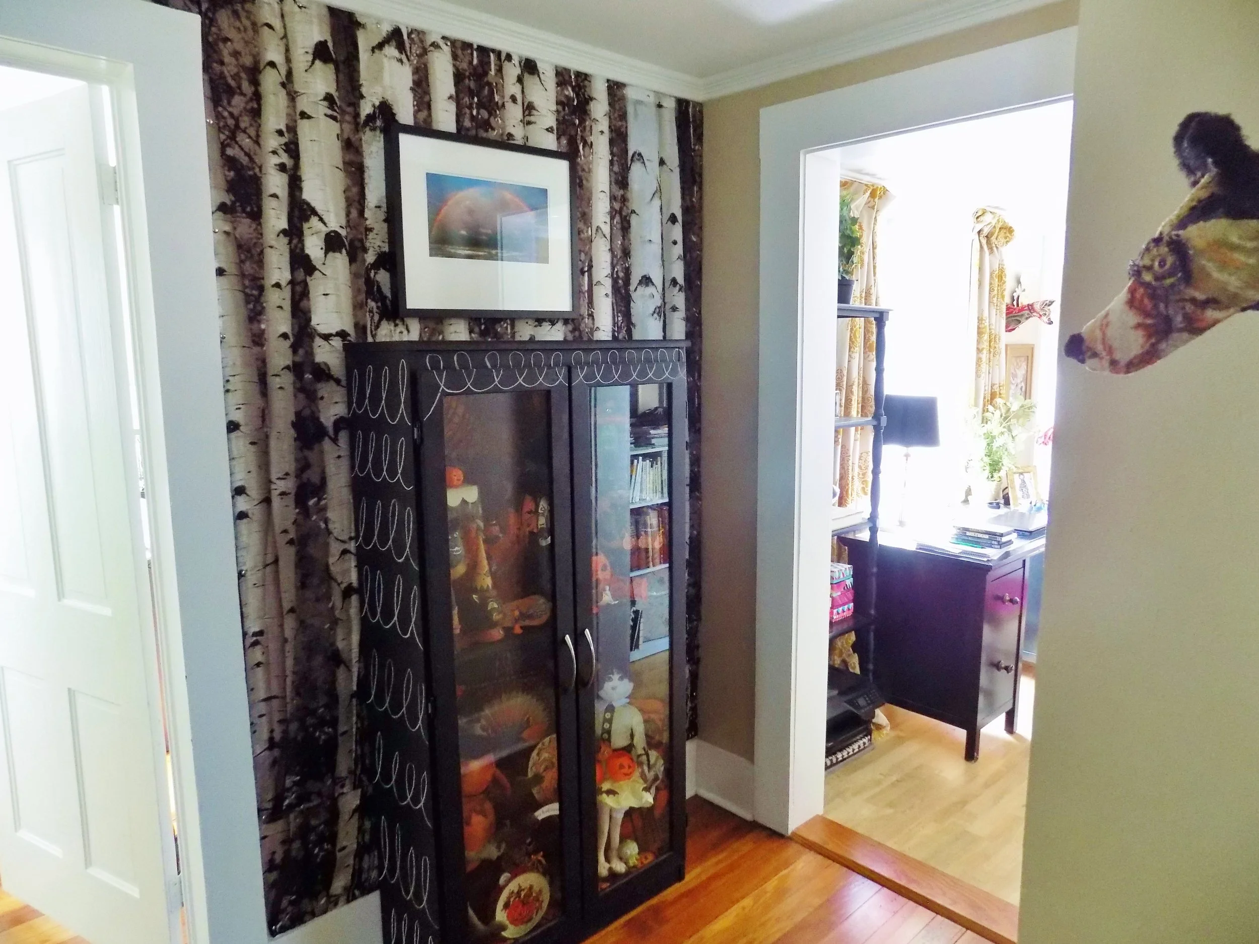  Front hall details. This enchanting chalkboard painted cabinet holds Lee's vintage Halloween collection.&nbsp; "You could say I'm passionate!" laughs Lee who believes she has over 300 pieces of vintage and vintage replica Halloween items. In fact he