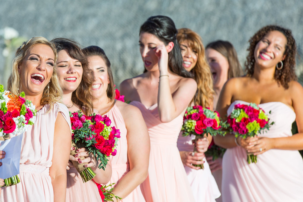 Bridesmaids luaghing and crying during their Cabo wedding