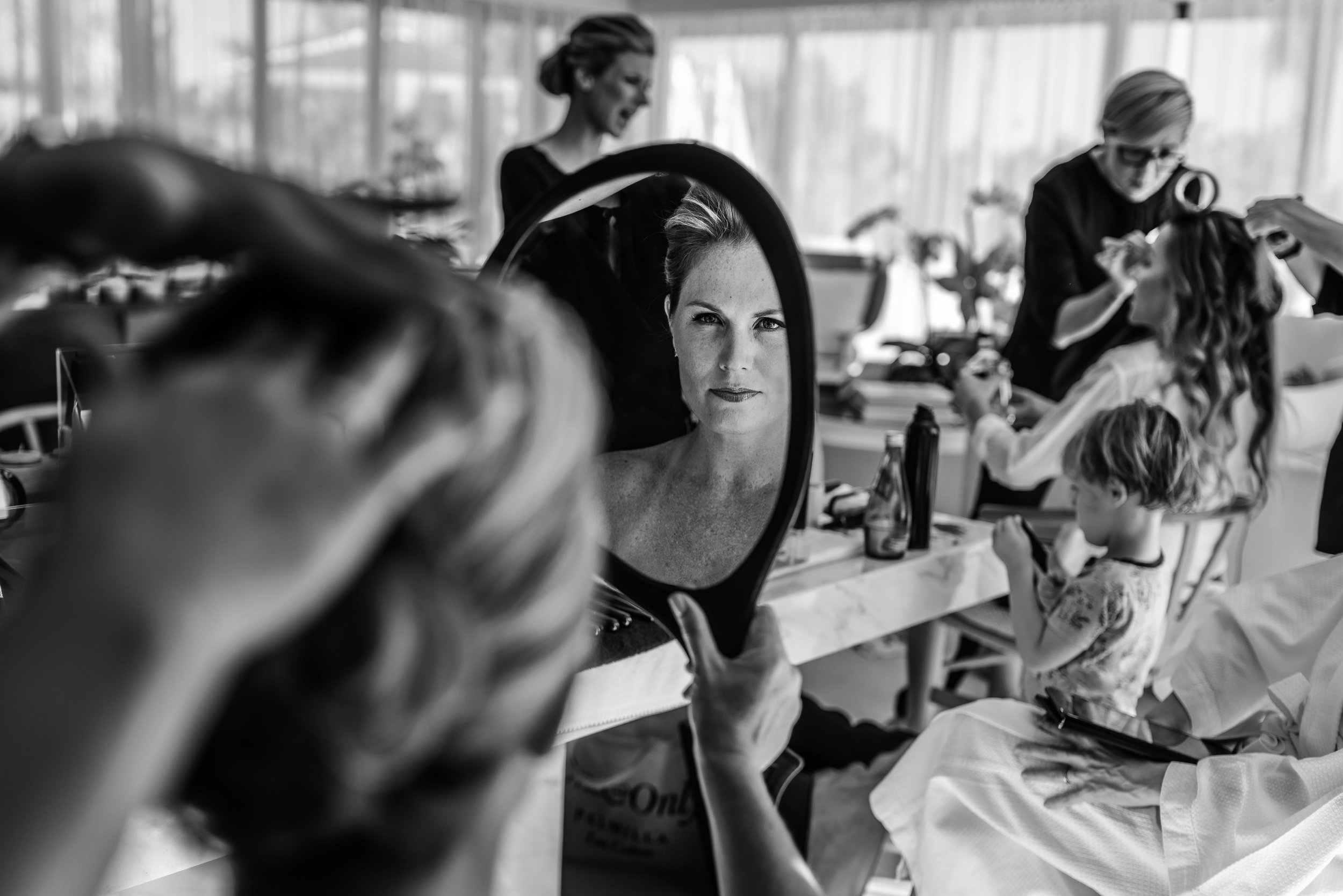 bride getting ready with friends and family