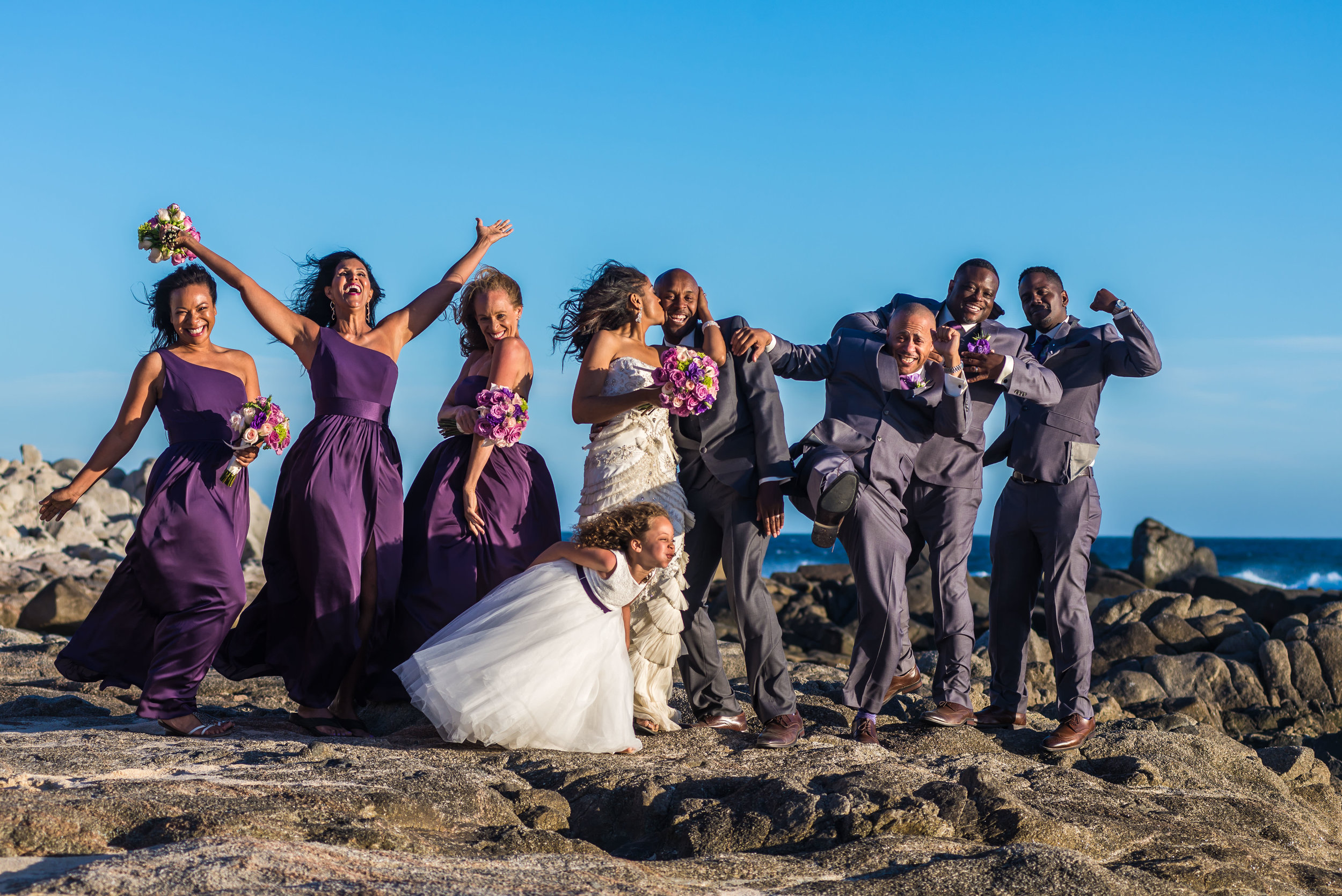  Bridal partyposing on the rocks during their photosession with talented GVphotographer 