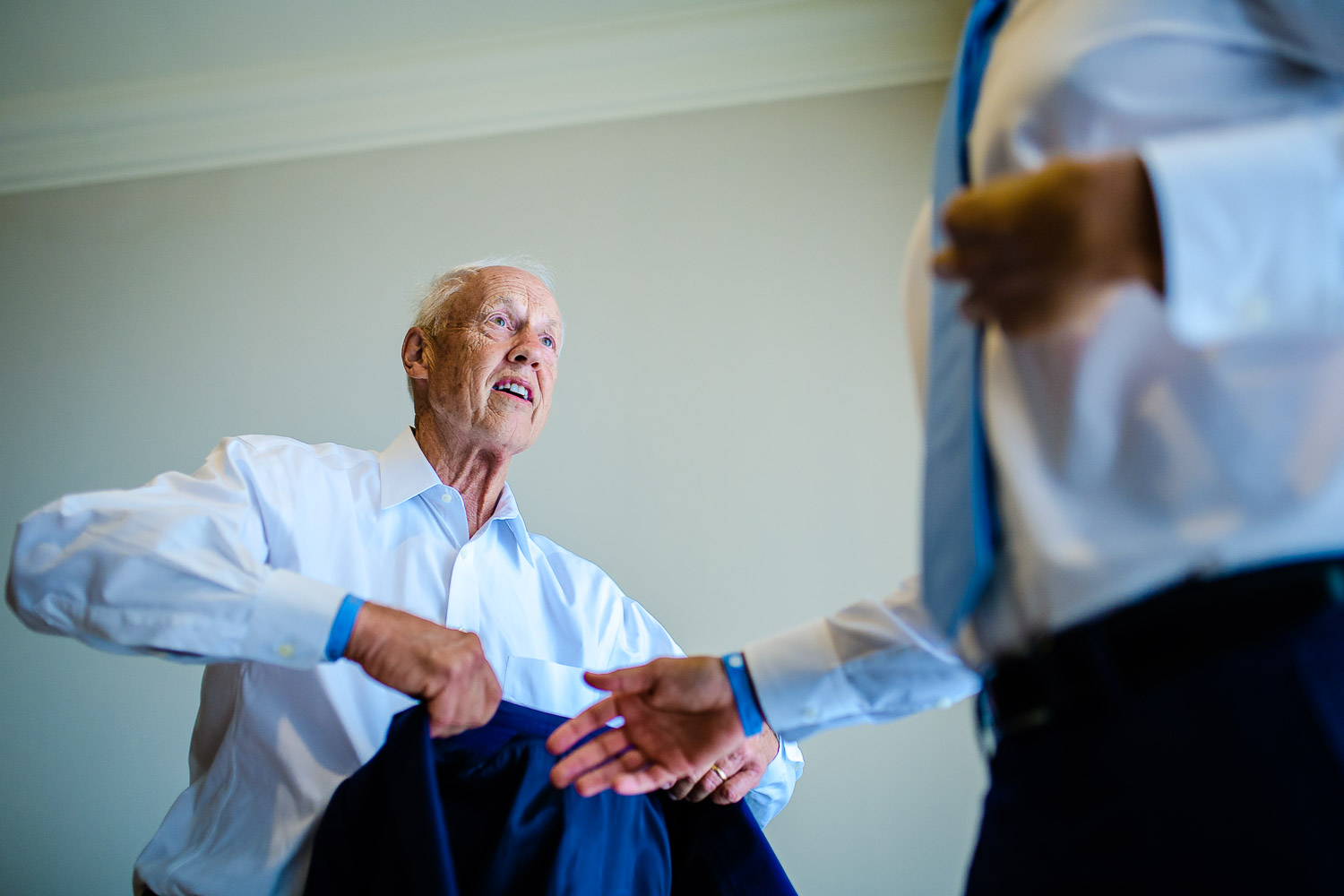  The handsome groom and his father are getting dressed for the big day of the couple. GVphotographer is a professional destination wedding photographer based in Cabo San Lucas, Mexico 