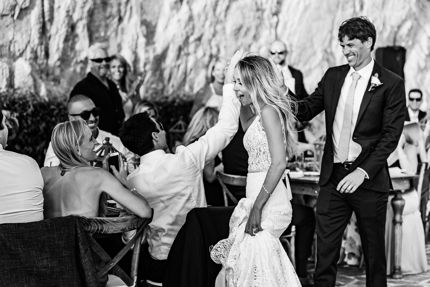  Bride and groom grand entrance on their wedding day at Pueblo Bonito Sunset Beach Los Cabos. GVphotographer is an amazing Los Cabos destination wedding porfessional photographer 