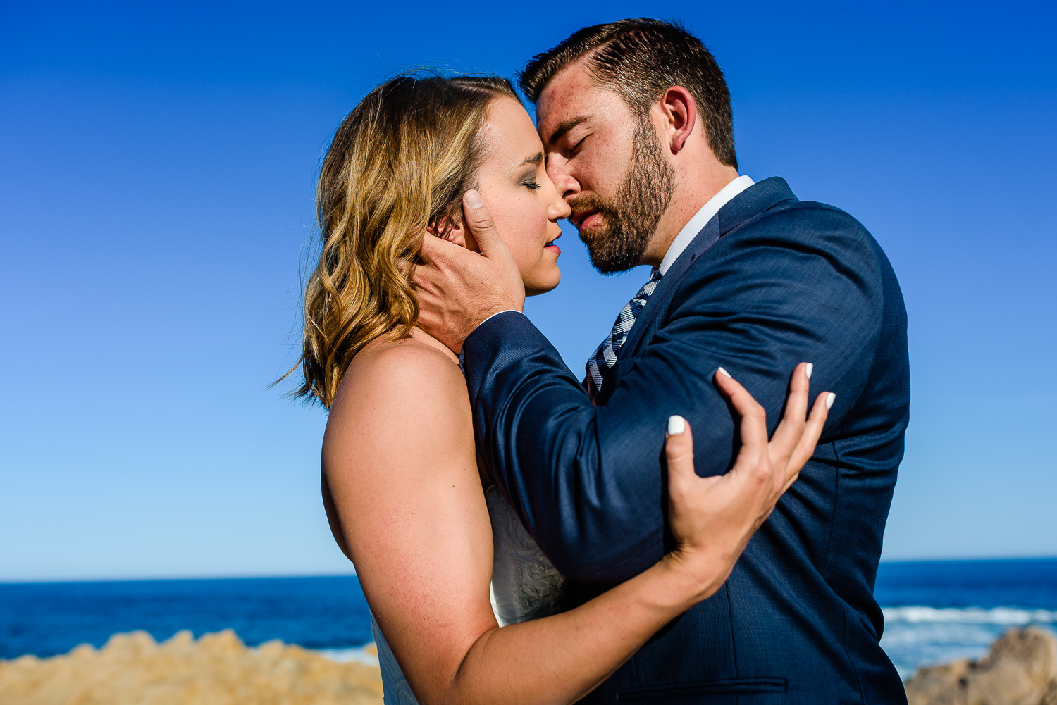  Kissing on the beach bride and groom during their first year anniversary photo session with local photographer GVphotographer 