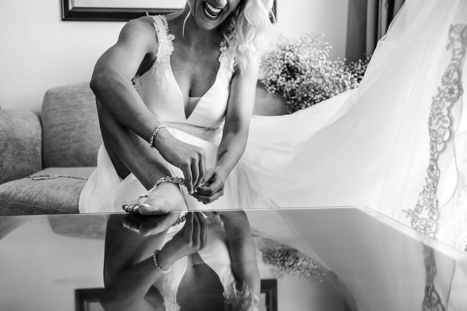 Bride laughing and getting fun during her getting ready