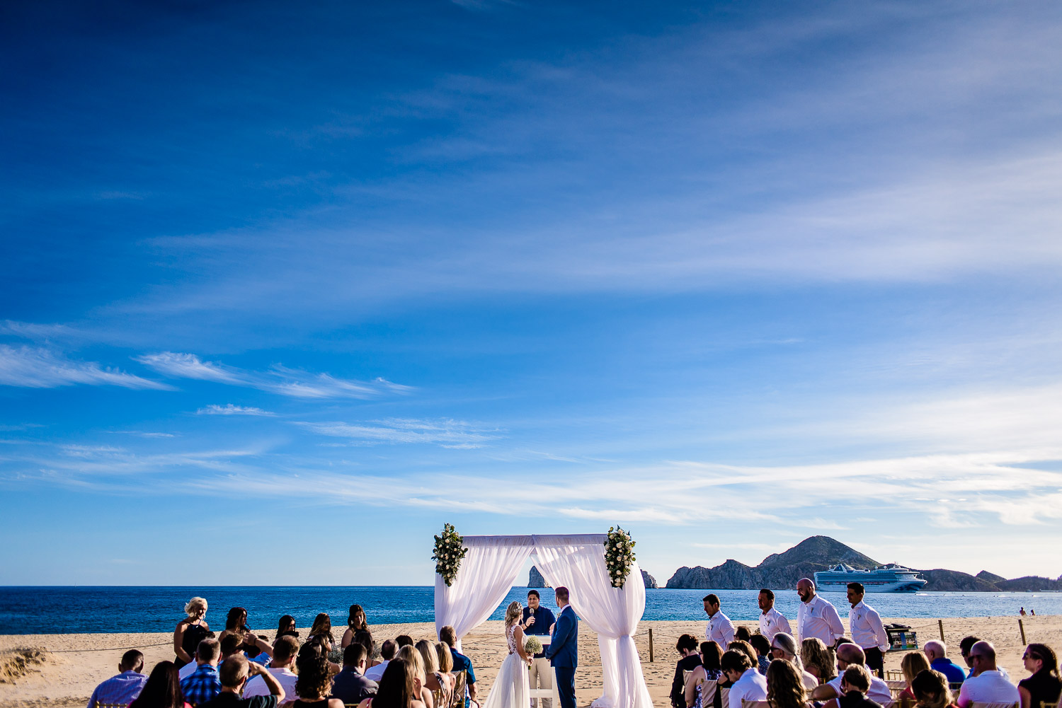 Riu Palace Caremony at Los Cabos, Mexico. Ocean and the famous Cabo Arch are behind the beach ceremony