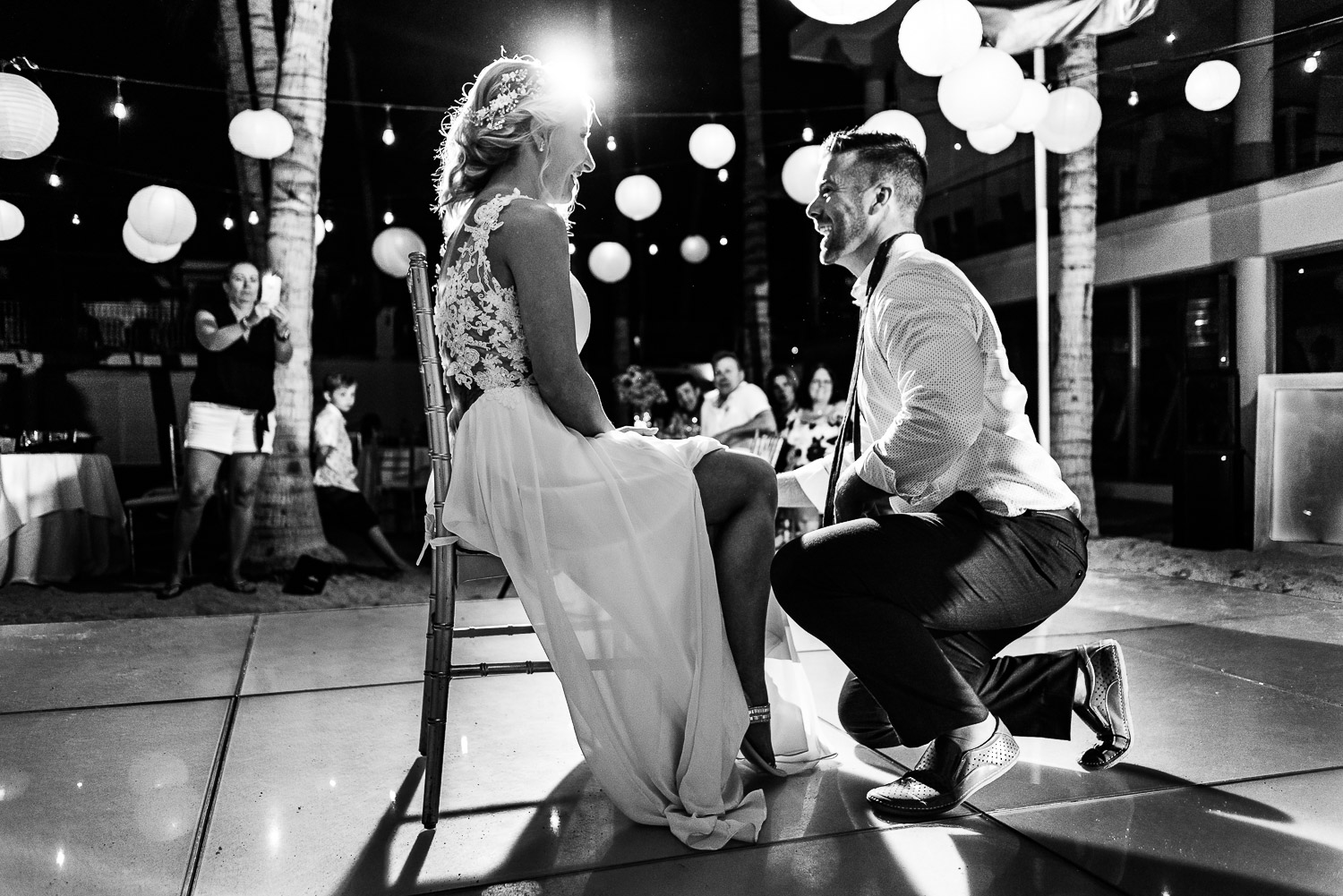 The funny bride's bouquet toss, groom's garter removal, and garter toss was a part of the wedding reception