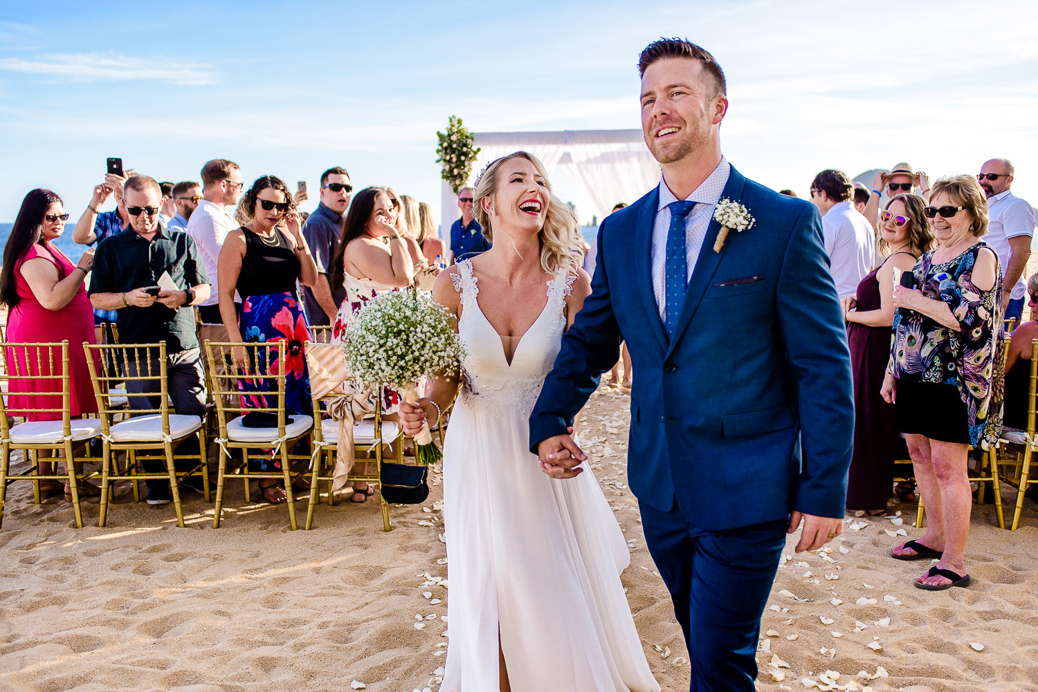 bride and groom exit on their Cabo destination Wedding