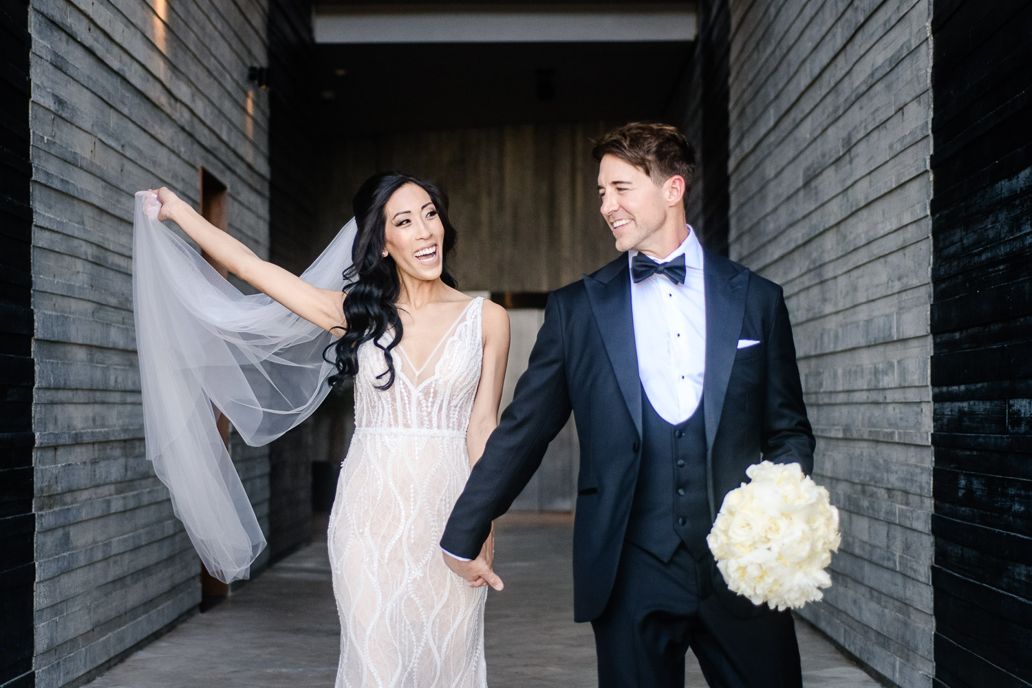 Bride and groom walking and having fun on their Los Cabos photo session (Copy)