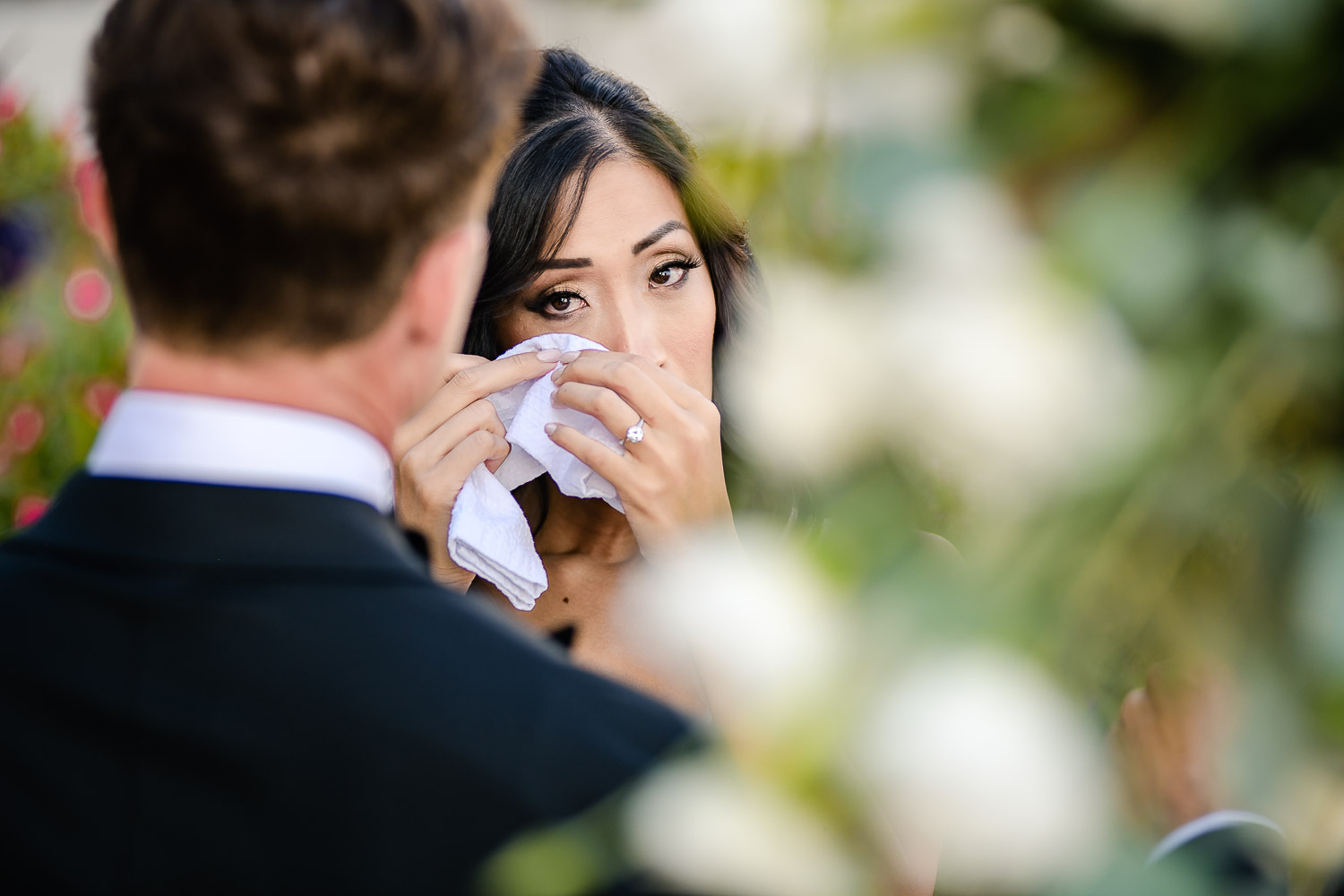 Bide and groom during their ceremony, bride is crying