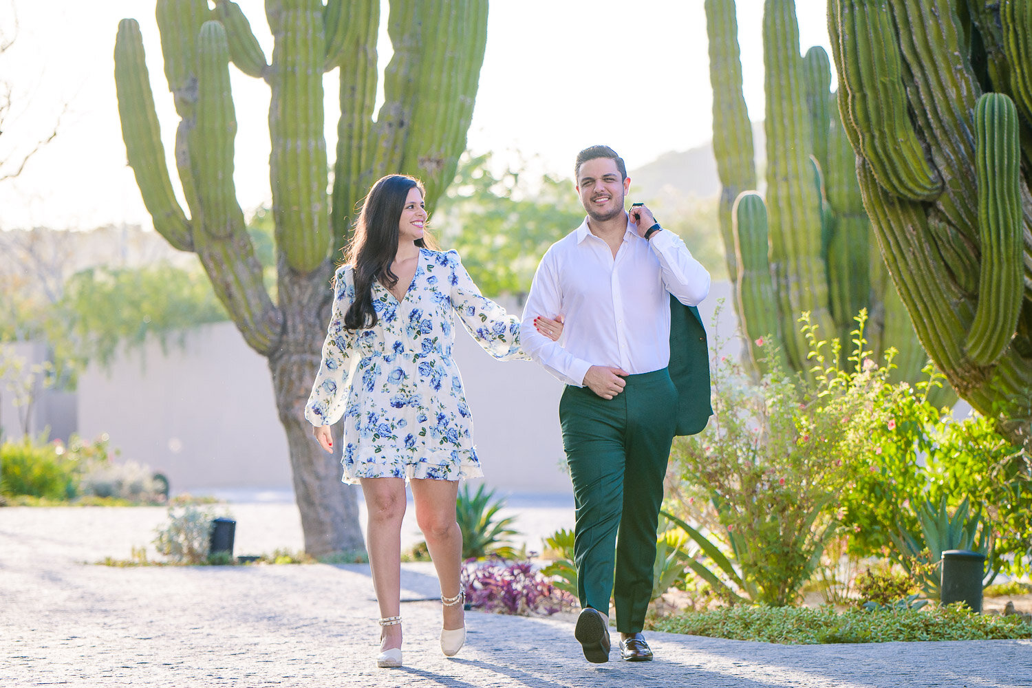 engaged couple walking at the Solaz Los Cabos Resort