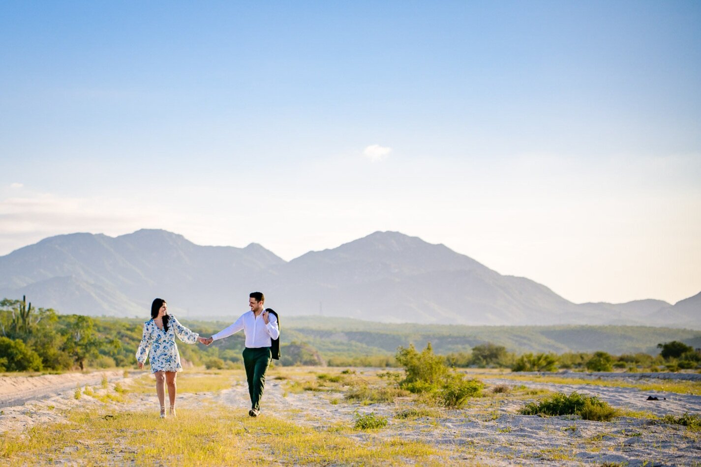 engaged couple walking and having fun during their Cabo photos