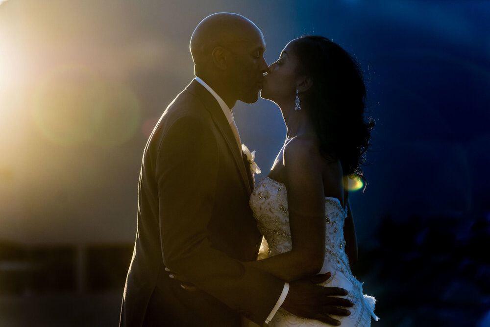 Bride and groom kissing and having fun during their wedding photo session with GVphotographer