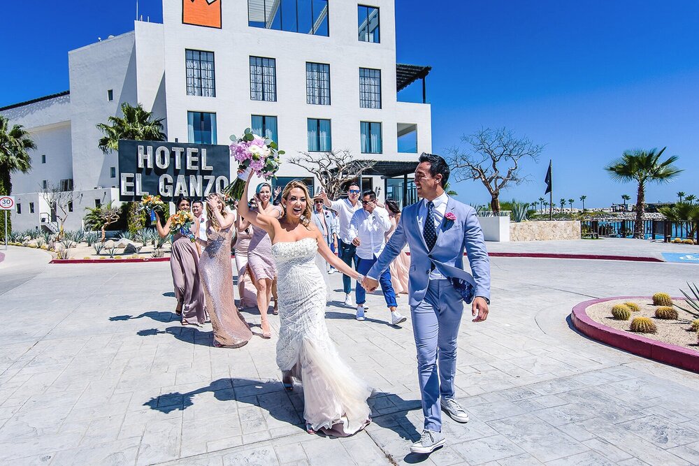 Bridal party walking and having fun in front of the Hotel El Ganzo
