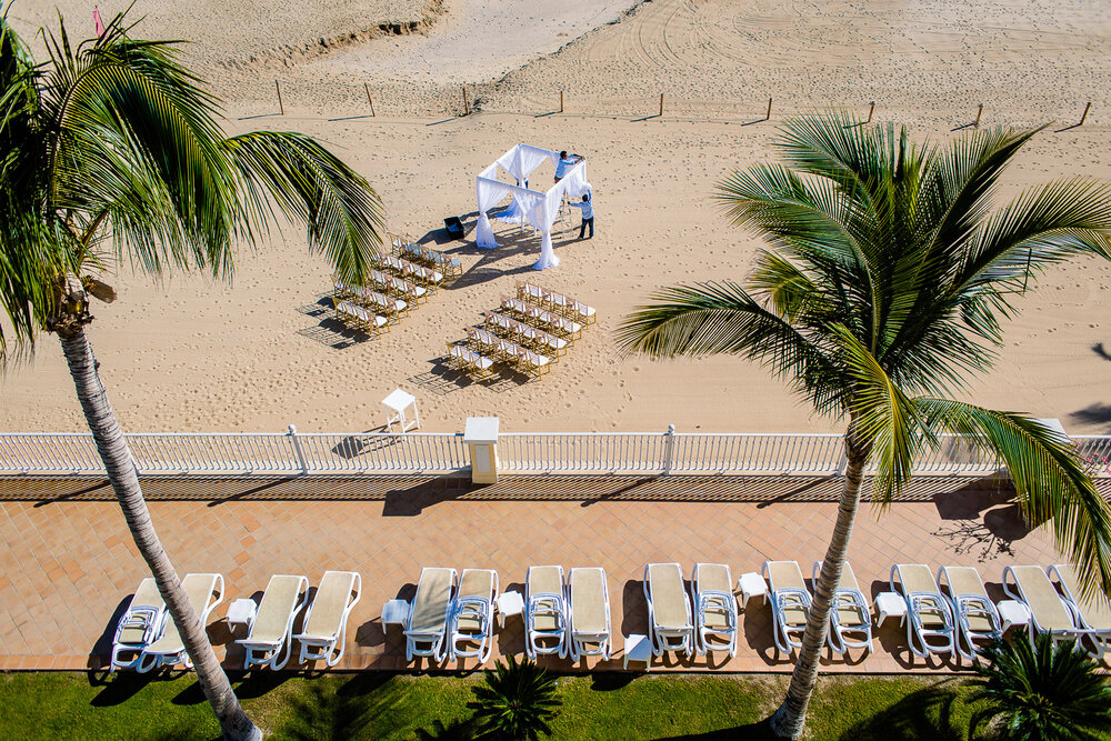 Getting the hupa ready for a beautiful destination wedding at the beach of Cabo San Lucas