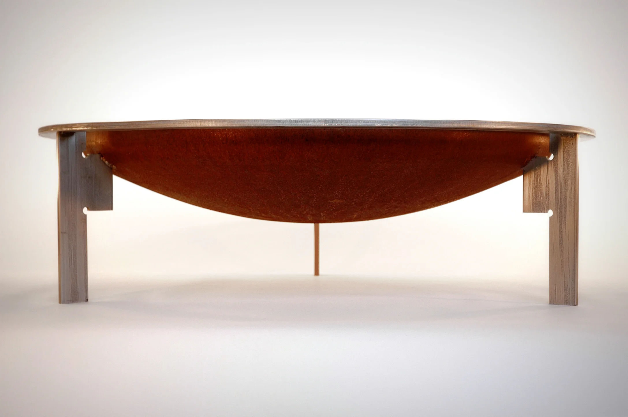 Bowl: 1/4" mild steel Legs: 1/2" stainless steel, inspired by Carlos Scarpa Rim: 1/2" stainless flat bar, rolled to create the rim that stands away from the bowl itself.