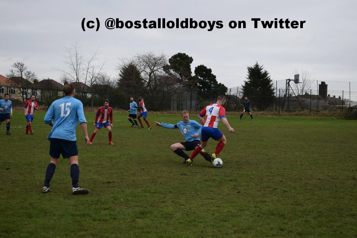 Bostall Old Boys captain Terry Tyrell goes in for a tackle v Elltham Phoenix during their 1-1 draw