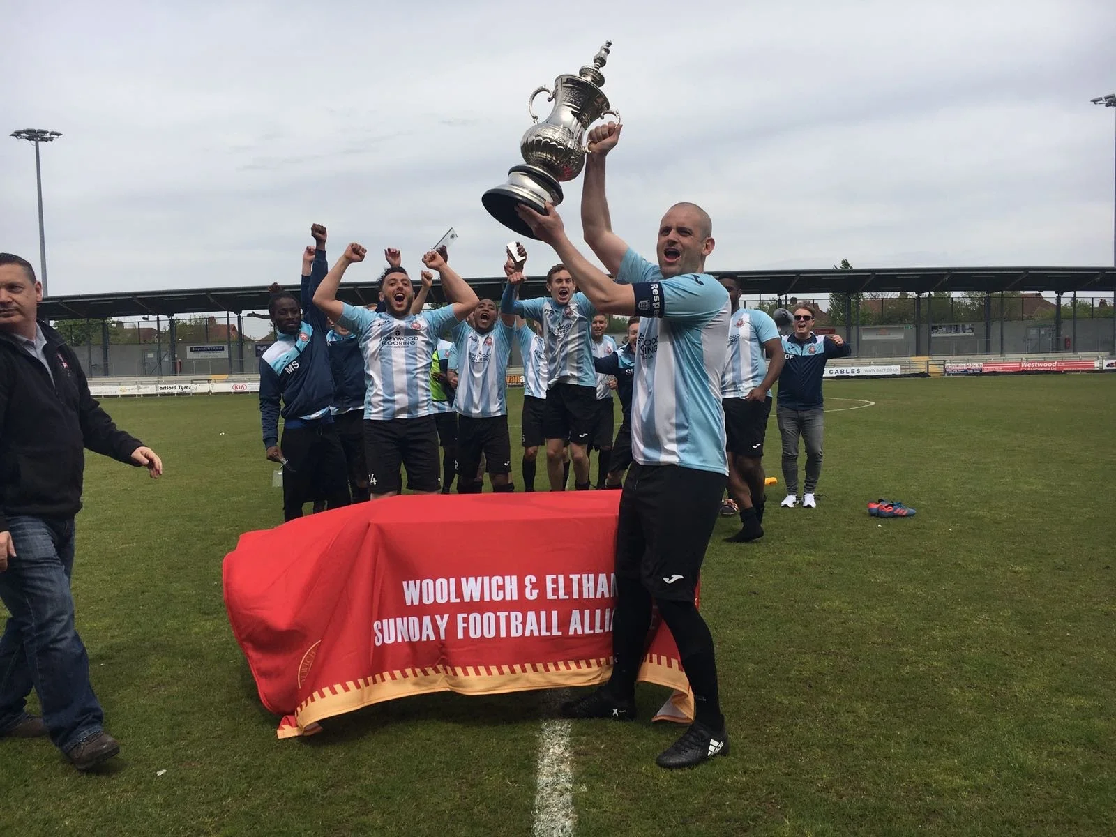 Kent Wanderers captain lifts the Len Wareham Cup